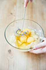 whisking eggs in a bowl