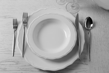 Table set at restaurant on light background