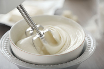 Fototapeta na wymiar Cooking buttery cream on kitchen
