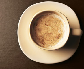 Cup of coffee on gray background