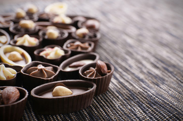 Chocolate sweets on fabric background