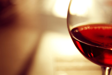 Glass of red wine on blurred background