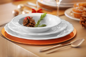 Christmas table setting with holiday decorations