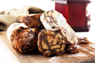 Chocolate salami candies and coffee-mill, close up
