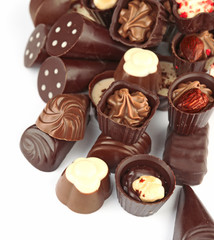 Assorted chocolate candies, isolated on white