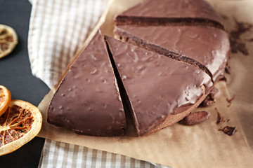 Sliced chocolate frosting cake with frosting