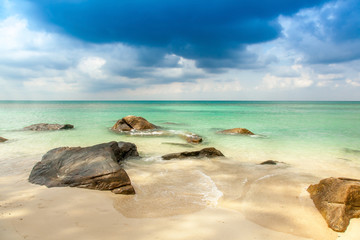 Fototapeta na wymiar view over a tropical beach with granite rocks, white sand and a