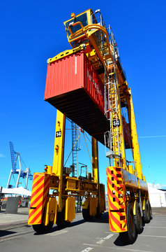 Straddle Carriers And Containers On Fergusson Wharf At Ports Of