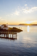 Sunset over Puget Sound and Mukilteo lighthouse with Whidbey Island in the distance