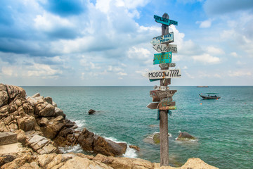 Beautiful seascape. Ancient pointer distances in different direc