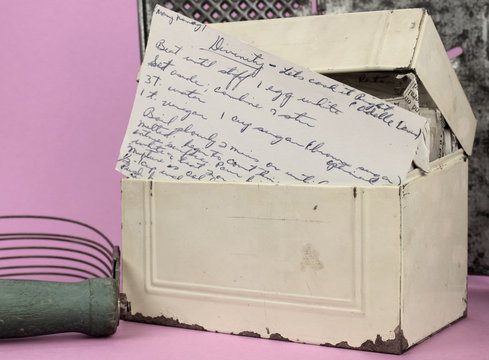 Vintage Tin Recipe Box With A Handwritten Recipe For Candy Showing In The Front.