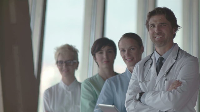 group of medical staff at hospital, doctor in front of team, people group  standing together in background