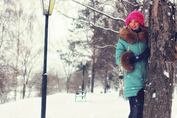 girl in winter street bench