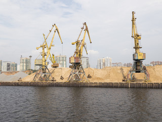 Fototapeta premium Yellow harbor cranes in North Port
