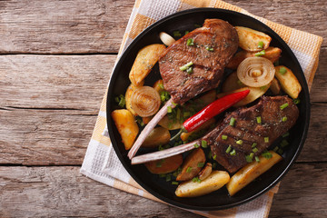 Beef steak with chili and fried potatoes. Horizontal top view
