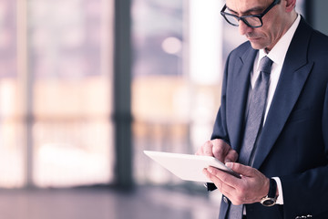 Fototapeta premium businessman using tablet computer in office
