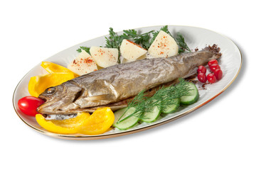 Baked trout with vegetables on the plate on a white background