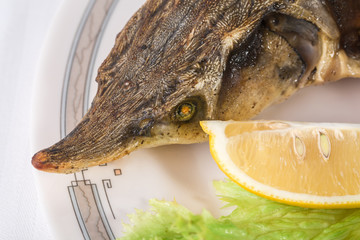 Head of baked sturgeon.
