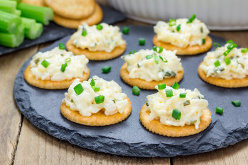 Baked crab dip, served with celery sticks and crackers
