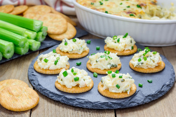 Baked crab dip, served with celery sticks and crackers