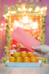 Man holding red envelope in Chinese new year festival
