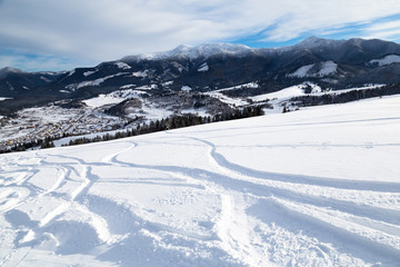 Ski slope with ski tracks