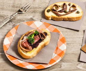 bruschetta with parma ham, anchovy fillet and broccoli inside pi