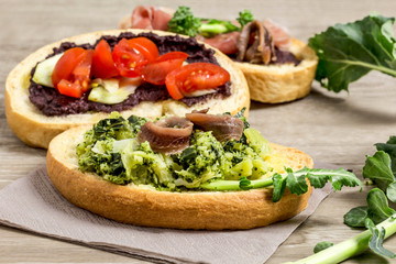 various bruschettas over wooden table