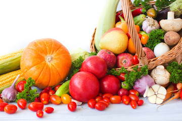 Wicker basket full of organic fruit and vegetables.