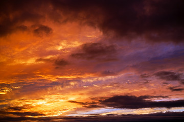 Naklejka na ściany i meble Dramatic sky at sunset as background