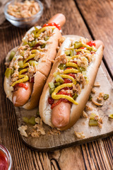 Hot Dog with onions, cucumbers and sauces