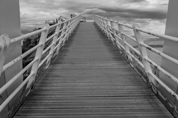 Obraz premium Iron bridge with wooden floors and rust by the sea, in Aviles, Spain