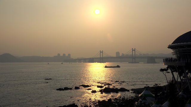 Nurimaru APEC House and Guangan Bridge at sunset. Busan