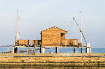 fishing hut with balance netfish in Adriatic Sea (Italy)