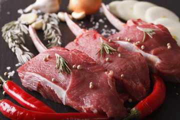 Raw beef steaks on a slate table macro. Horizontal
