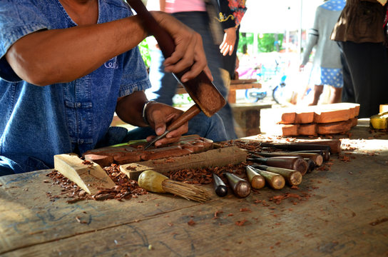 Thai people carving traditional thai art wood figure