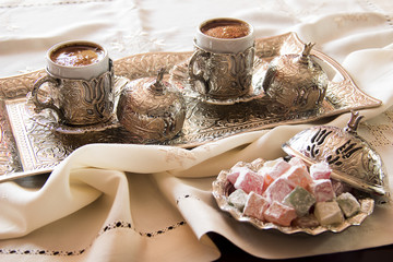 Turkish coffee with delight and traditional silver serving set