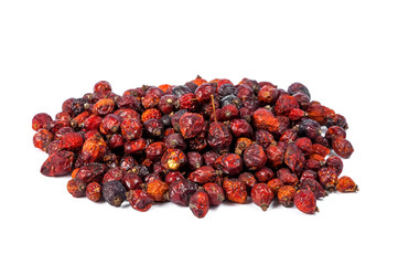Pile of dried rose hips isolated on white background