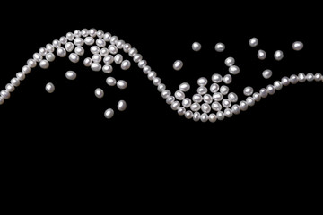 beautiful pearls on black background