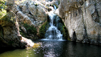 Fototapeta na wymiar spring mountain waterfall