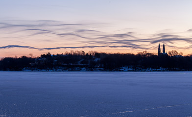 Fototapeta na wymiar Winter morning in Stockholm. Funny looking clouds over the island of 