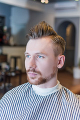 Portrait of man in barber shop