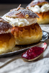 Homemade buns with jam and cream