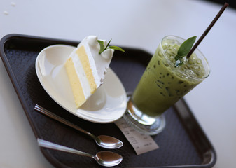 Fresh milk cake with ice green tea 