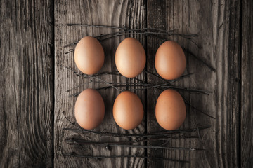 Chicken eggs on a wooden table