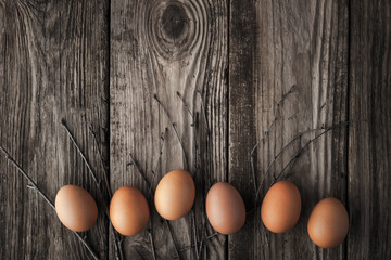 Chicken eggs on a wooden table