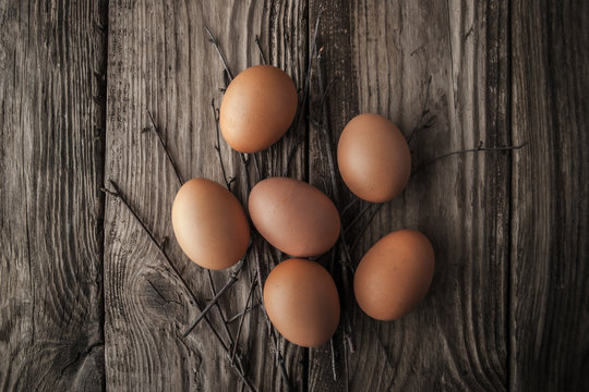 Chicken eggs on a wooden table