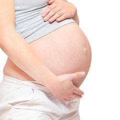 Fototapeta na wymiar Pregnant belly on white background. Pregnancy and maternity concept.