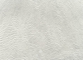 white background image of travertine with wavy lines
