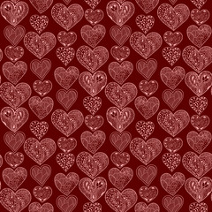 Seamless pink hearts vertical pattern on brown background